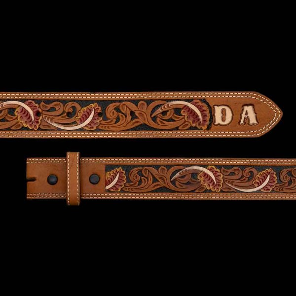 "This Classic Western-Style Belt is beautifully crafted with an intricate tooling pattern and customizable tip for your initials or lettering. Crafted on high-quality top grain leather. This belt is double stitched. Detailed with a hand-painted base 